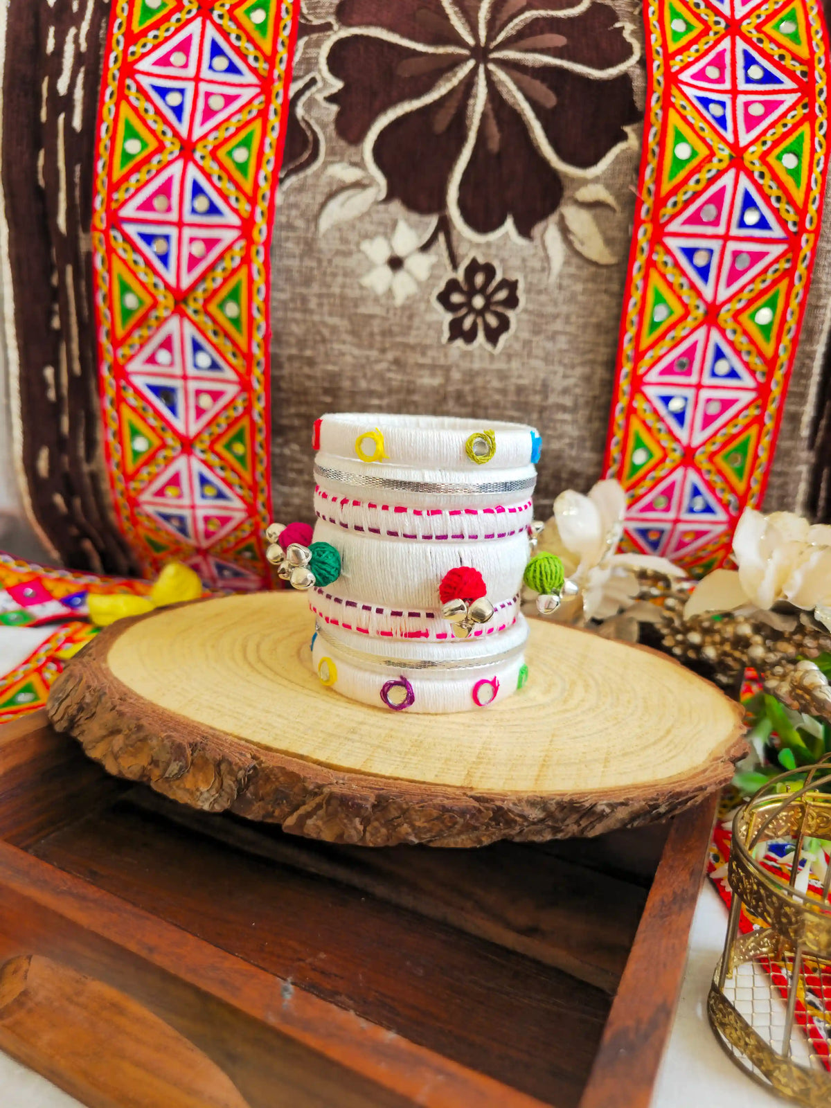 Aadhya Bangles pink thread bangles with mirror work and silver ghunghru and pom pom side view