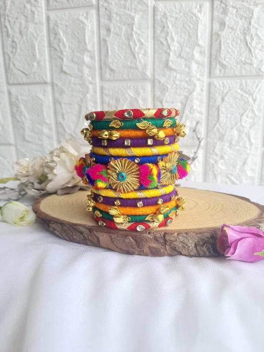 Aadhya Bangles pink thread bangles with Pom pom,kundan stone, Golden leaf ghughru and pom pom side view