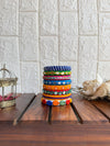 Aadhya Bangles — Multicolor thread bangles with mirror work, silver bells, kundan stones, silver charm ghungroo, parrot motifs, cowrie shells