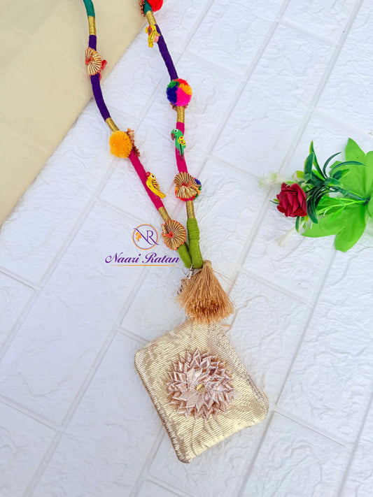Shop Rangeeli Mobile Sling NMS02 by Naari Ratan - handcrafted thread mobile sling with tassels, bells, and brocade pouch, perfect for Garba and Navratri styling Side View
