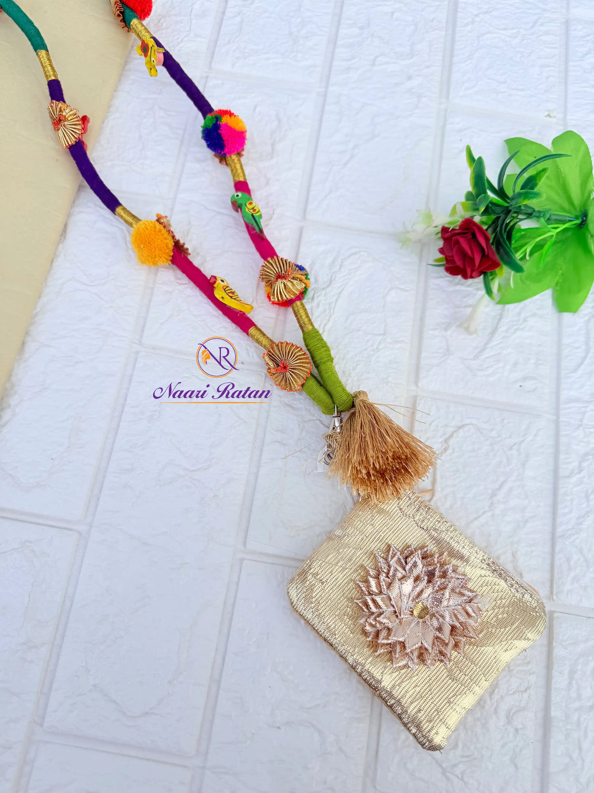 Shop Rangeeli Mobile Sling NMS02 by Naari Ratan - handcrafted thread mobile sling with tassels, bells, and brocade pouch, perfect for Garba and Navratri styling.