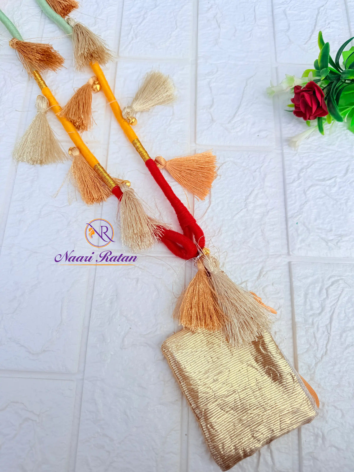 Mint, yellow and red thread-wrapped mobile sling bag with tassels by Naari Ratan