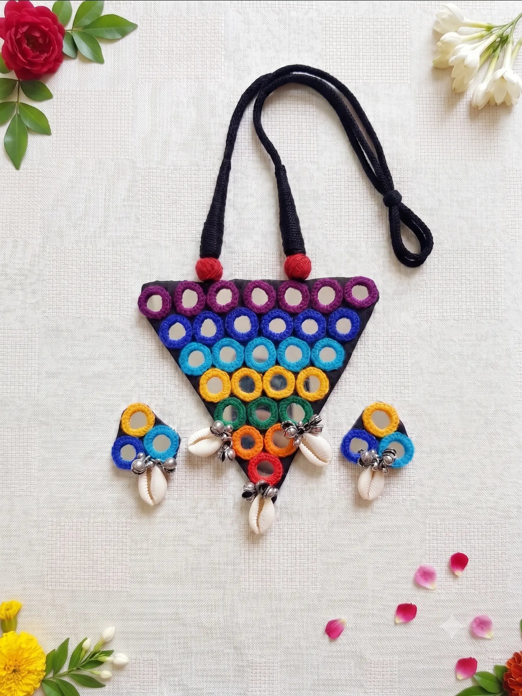 Handmade multicolor Navratri necklace and earrings set with mirror work and cowrie shells for women by Naari Ratan