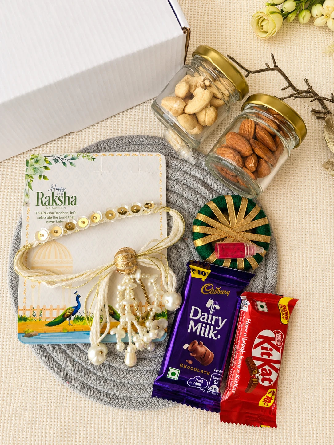 Rakhi Hamper RH06 with Rakhi and festive treats by Naari Ratan