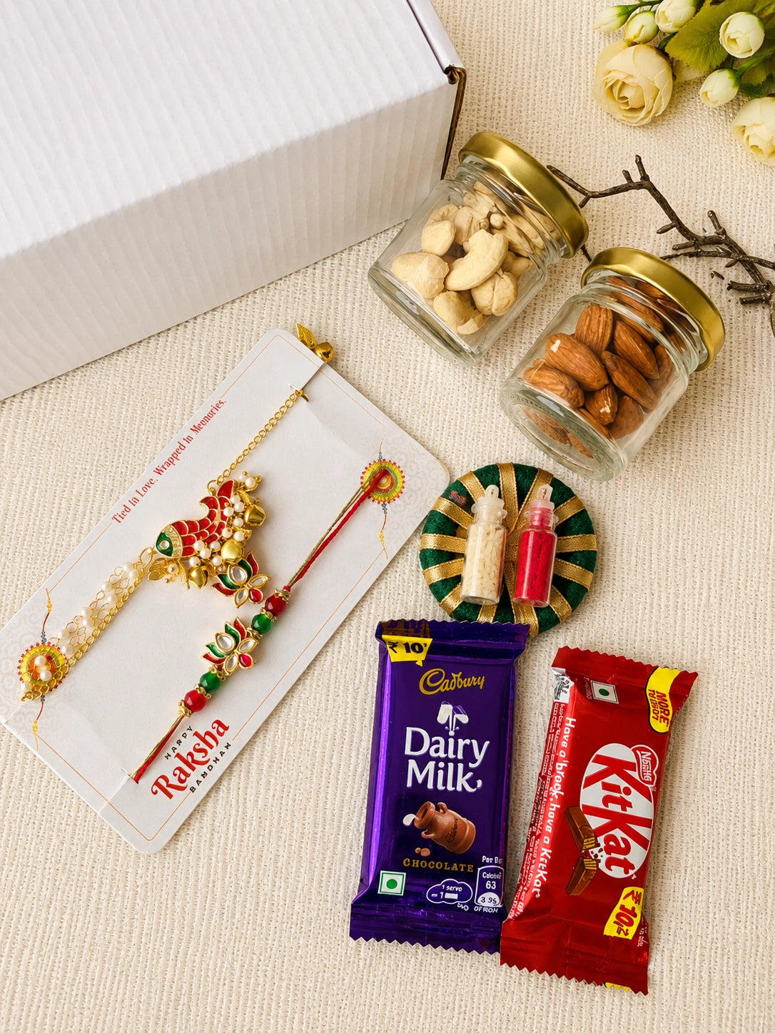 Rakhi Hamper RH09 with Rakhi and festive treats by Naari Ratan
