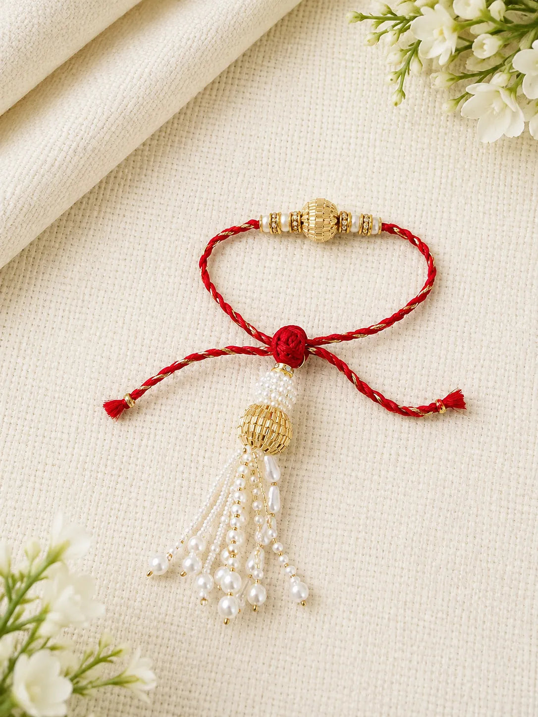 Handmade Sister Bhabhi Lumba Rakhi SB04 with pearl tassel and kundan design by Naari Ratan