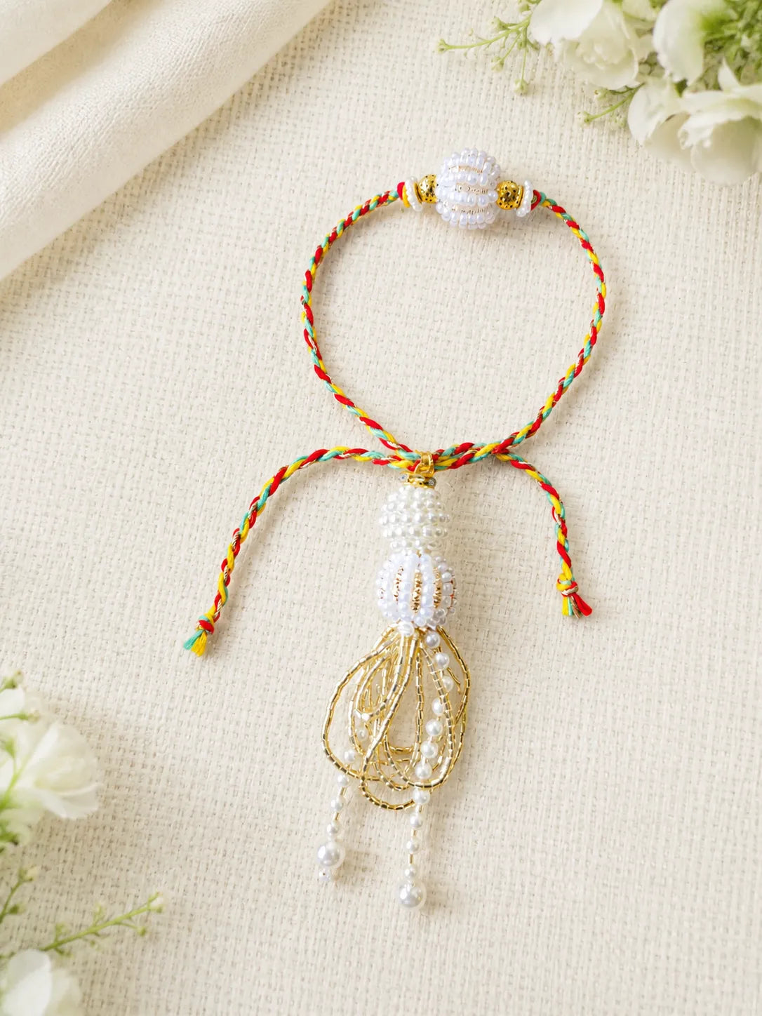 Handmade Sister Bhabhi Lumba Rakhi SB05 with pearl tassel and kundan design by Naari Ratan